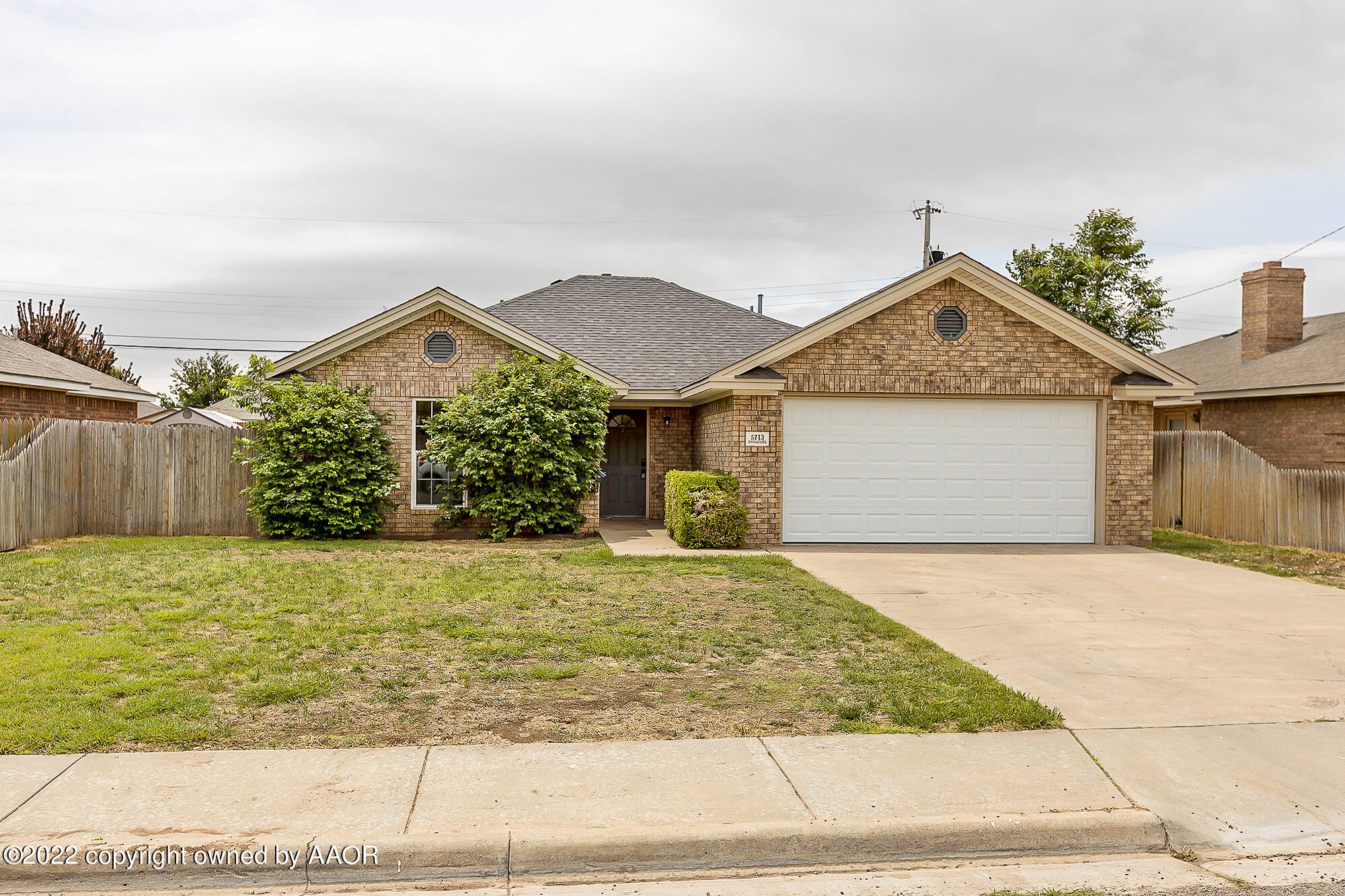 5713 Syracuse Drive Amarillo, TX 79109 - Photo 1 of 1 a front view of a house with garden