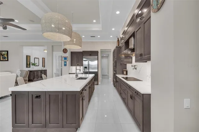 a bathroom with a granite countertop sink a vanity and a shower