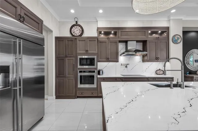 a bathroom with a granite countertop sink a toilet and shower