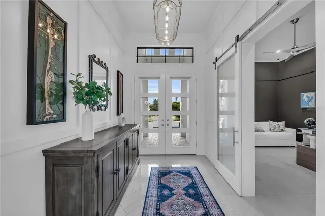 a living room with furniture and potted plant