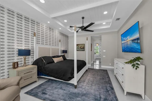 a living room with furniture a clock and a window