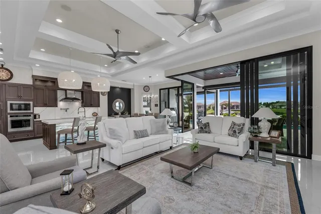 a kitchen with stainless steel appliances granite countertop a sink and a refrigerator