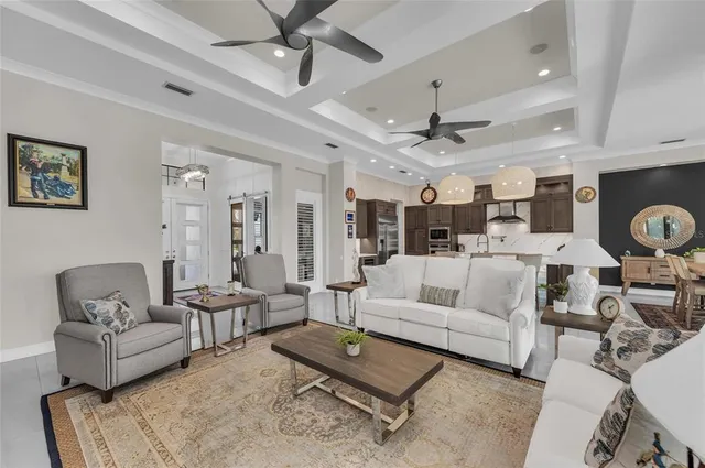 a kitchen with stainless steel appliances granite countertop a sink and a refrigerator