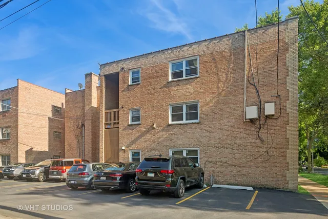 a car parked in front of a brick building