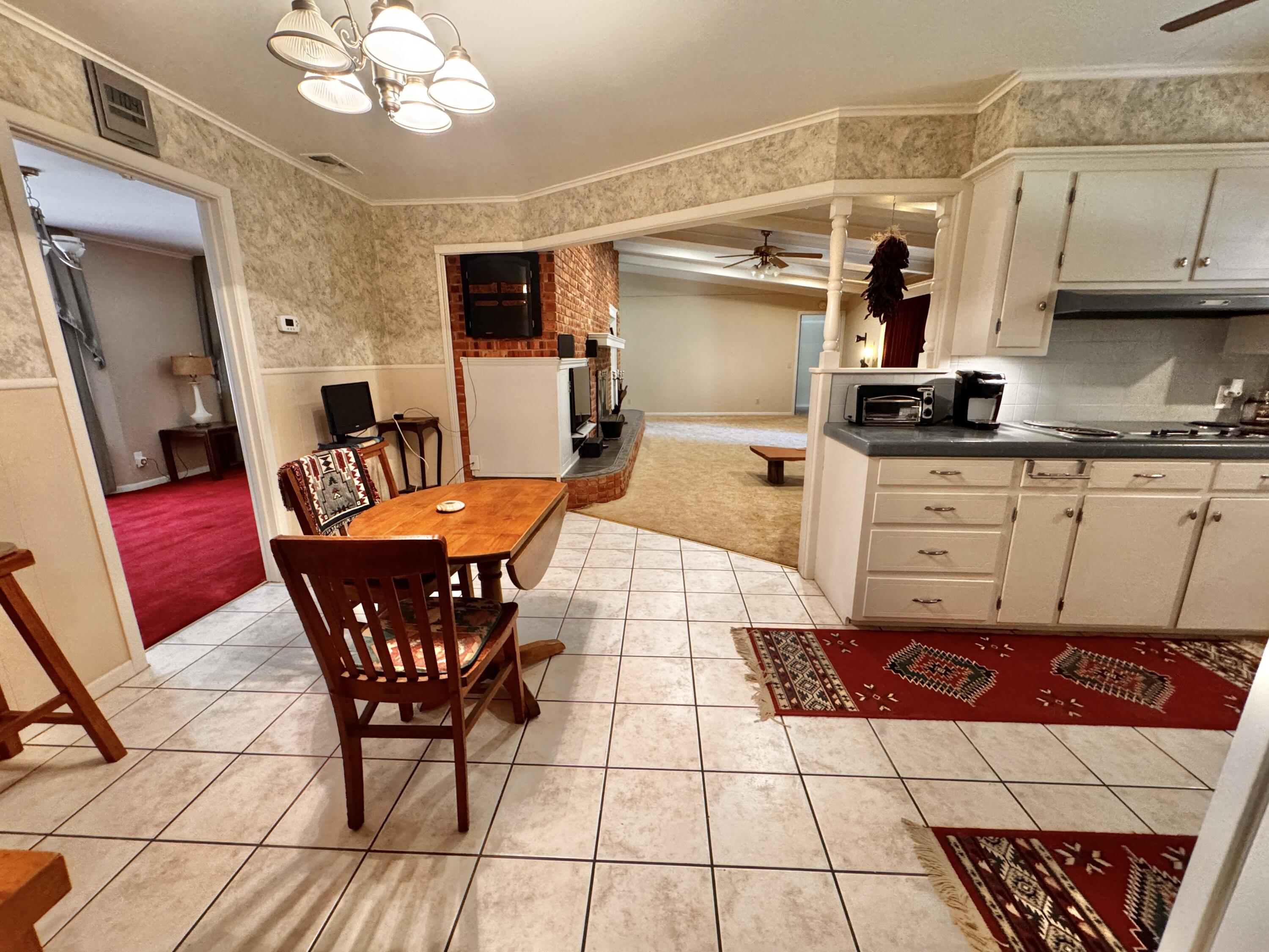 1403 Amarillo Plainview, TX 79072 - Photo 18 of 48 a kitchen with stainless steel appliances kitchen island granite countertop a sink and cabinets
