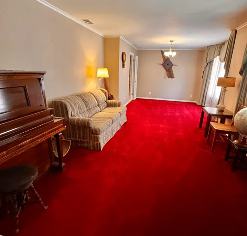 a bedroom with bed and a window