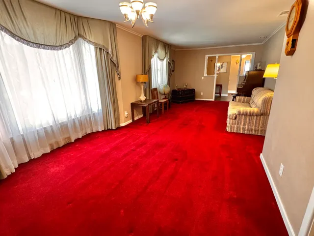 a living room with furniture and a pool