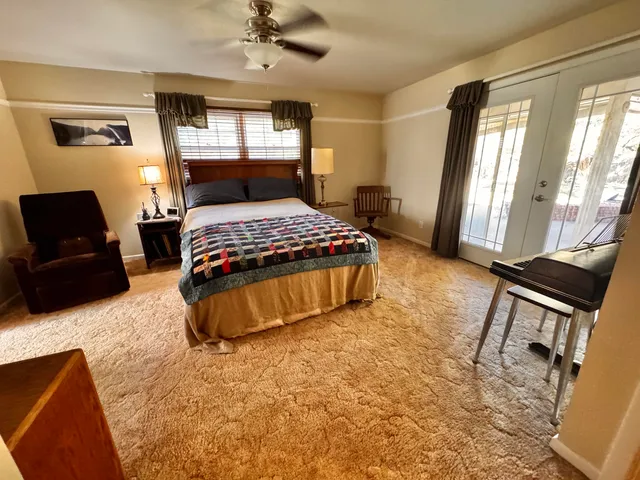 a bedroom with a bed and window