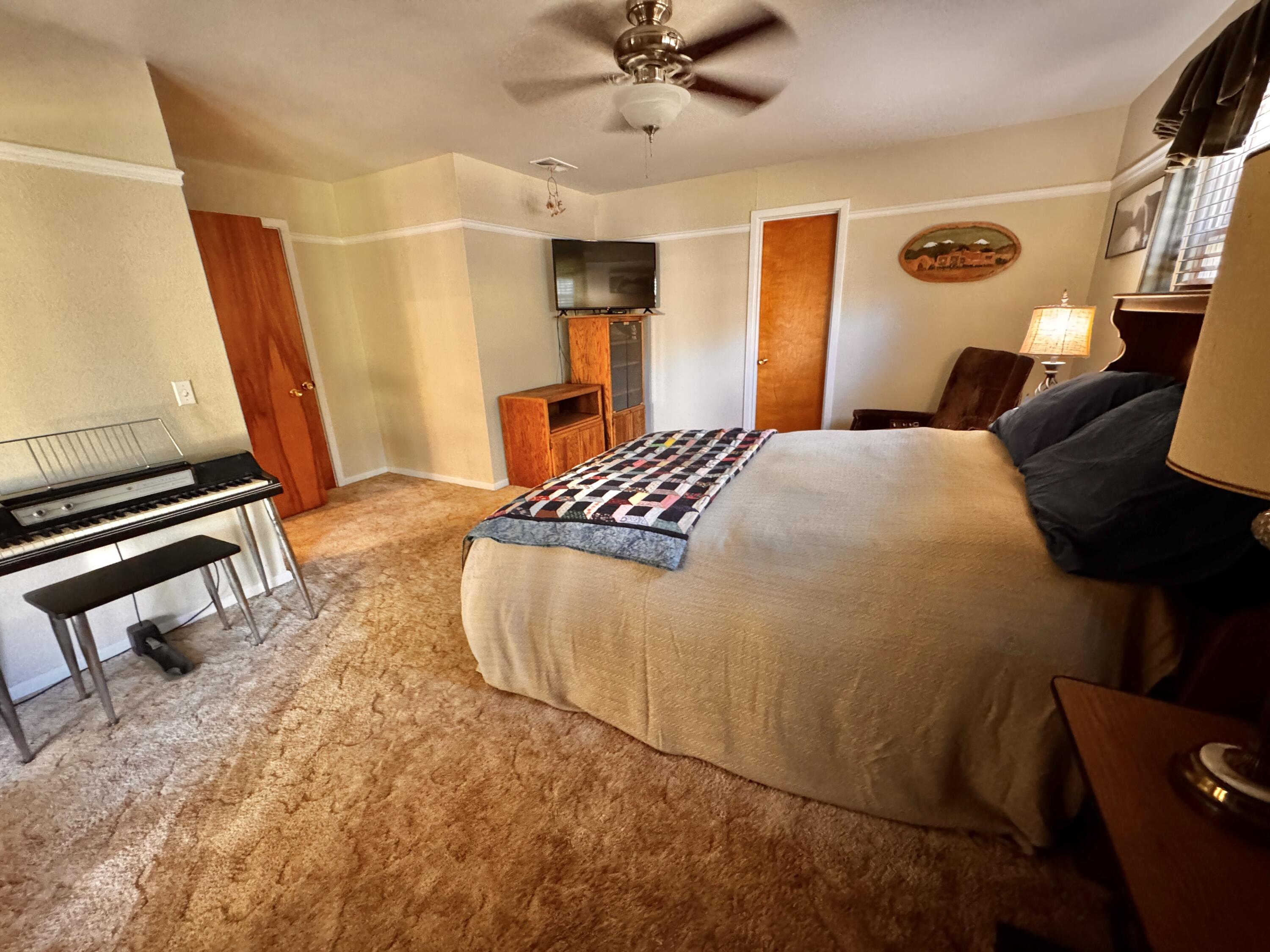 1403 Amarillo Plainview, TX 79072 - Photo 25 of 48 a bedroom with a bed and wooden floor
