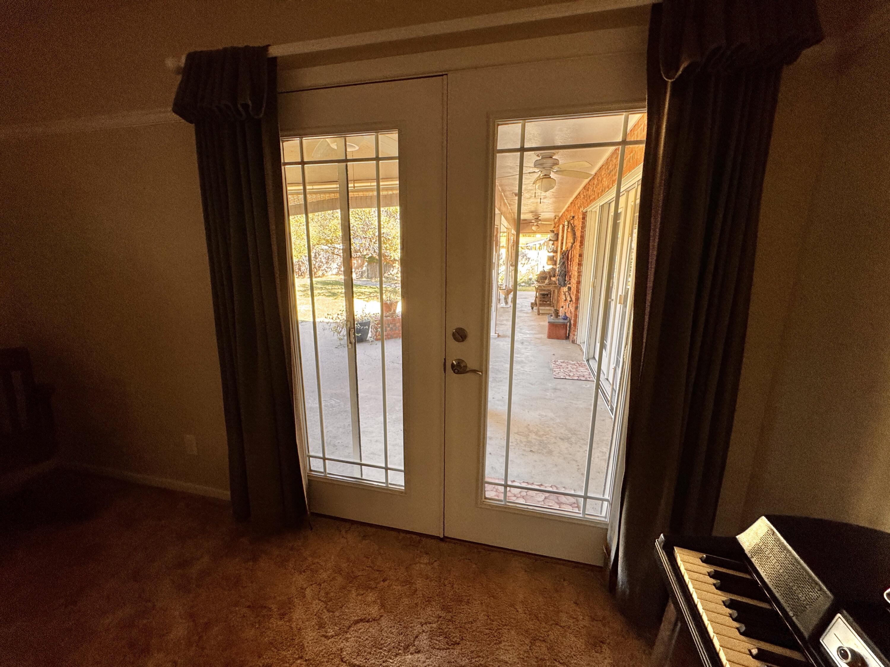 1403 Amarillo Plainview, TX 79072 - Photo 26 of 48 a view of an empty room with wooden floor and windows