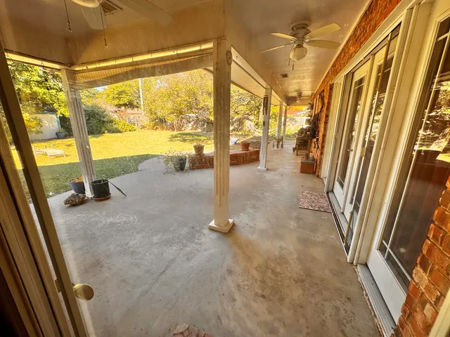a view of a floor to ceiling window and an entrance