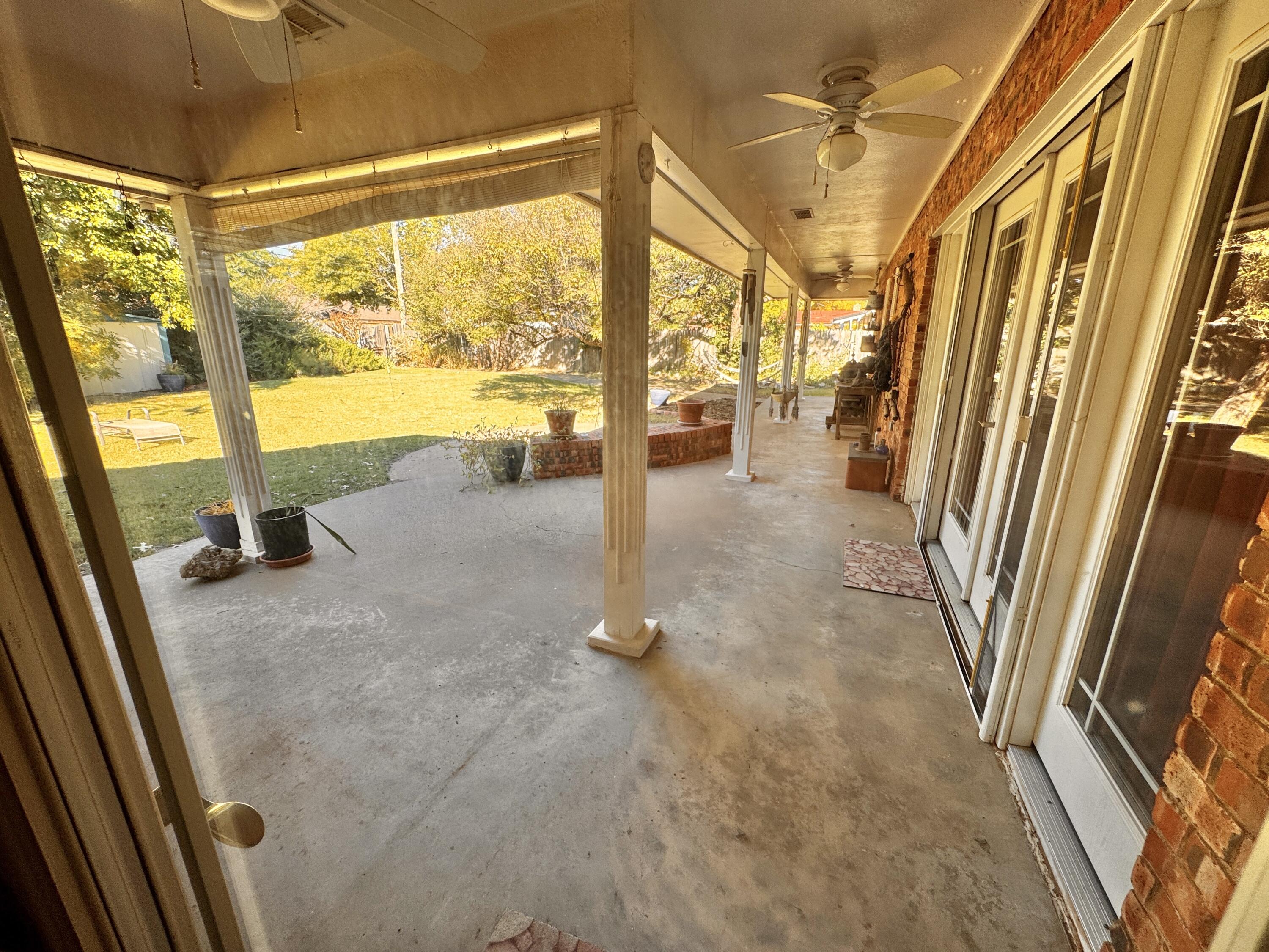 1403 Amarillo Plainview, TX 79072 - Photo 27 of 48 a view of a floor to ceiling window and an entrance