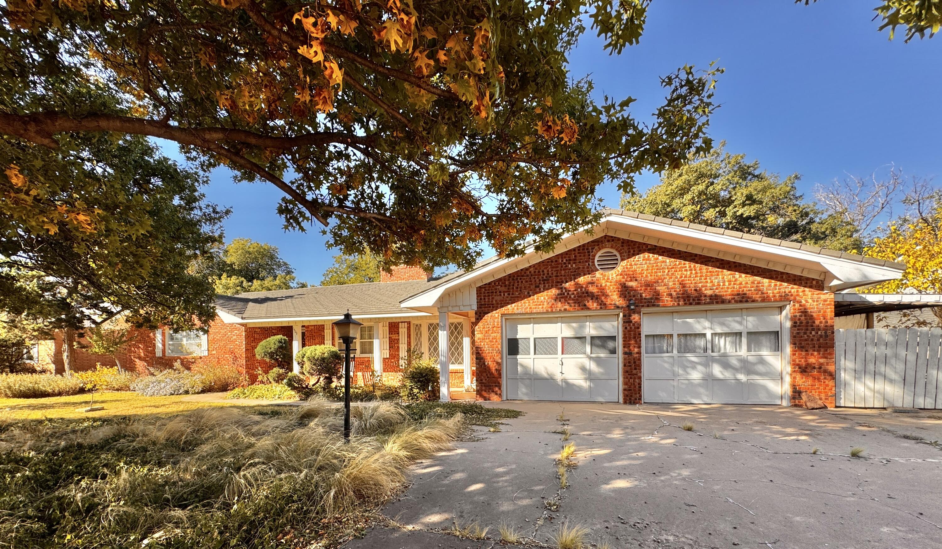 1403 Amarillo Plainview, TX 79072 - Photo 3 of 48 a backyard of a house with table and chairs