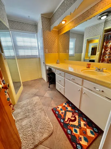 a bathroom with a toilet and a shower curtain