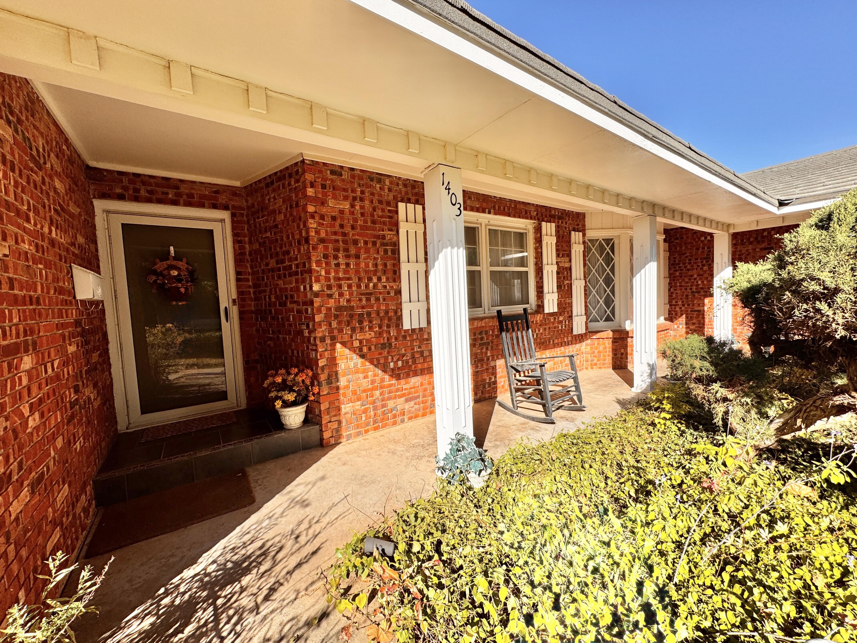 1403 Amarillo Plainview, TX 79072 - Photo 4 of 48 a front view of a house with garden