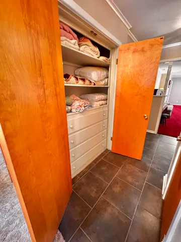 a view of a door and an empty room