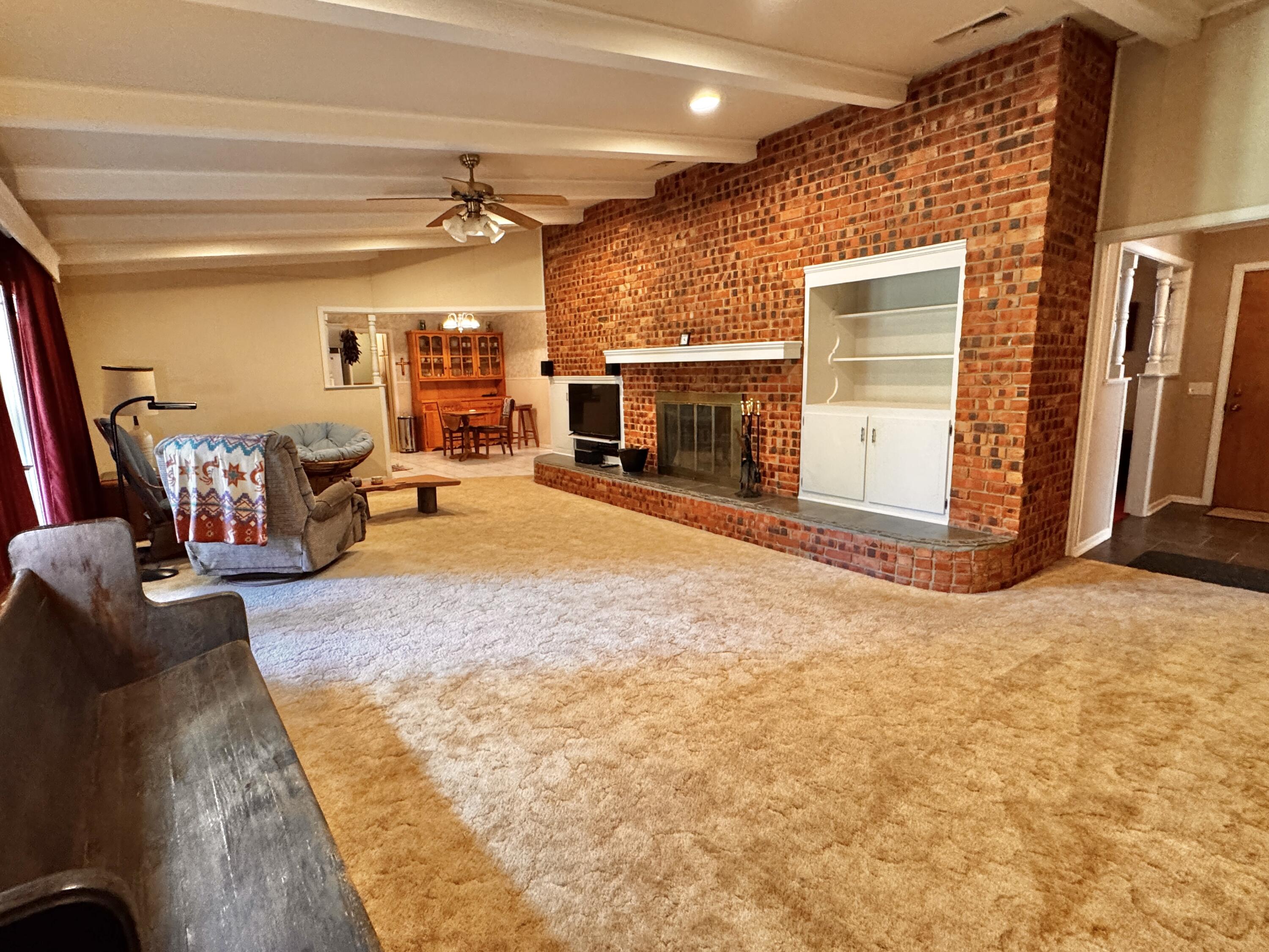 1403 Amarillo Plainview, TX 79072 - Photo 9 of 48 a view of a livingroom with furniture and a fireplace