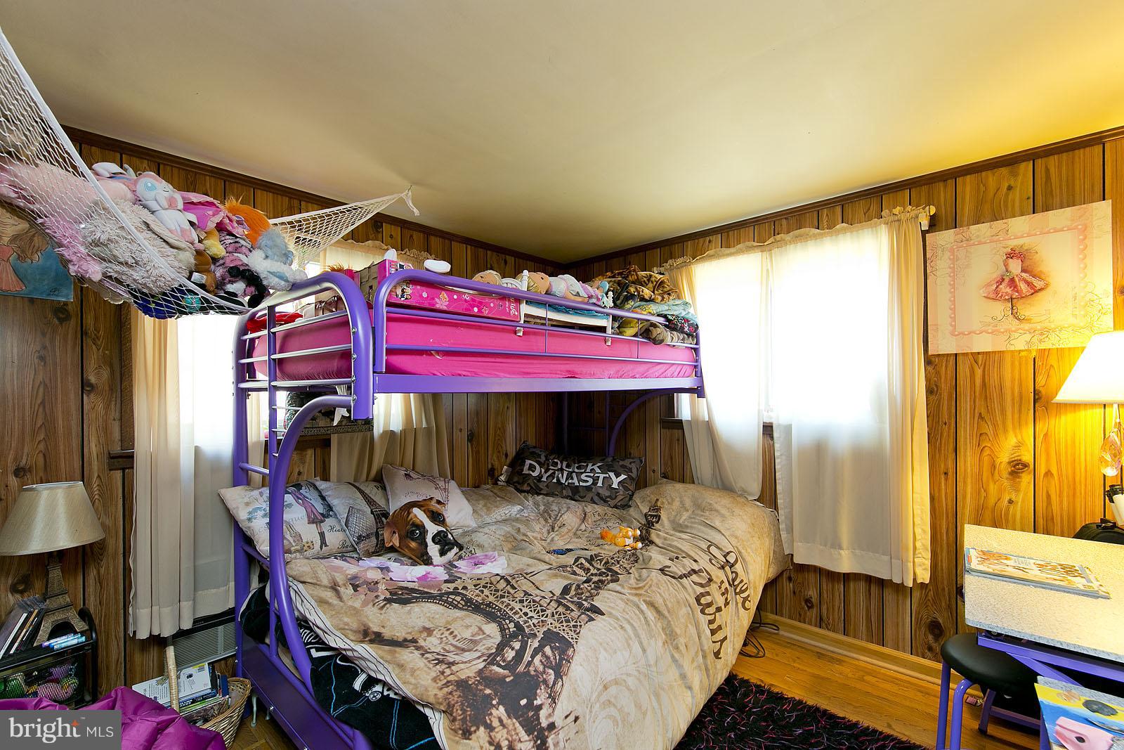 496 Audubon Road Hedgesville, WV 25427 - Photo 18 of 30 a bed room with a bed and a desk