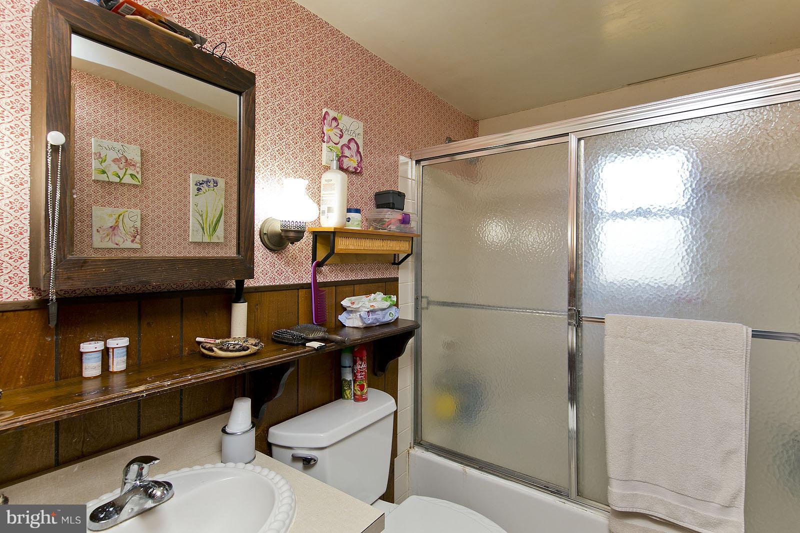 496 Audubon Road Hedgesville, WV 25427 - Photo 20 of 30 a bathroom with a sink mirror and toilet