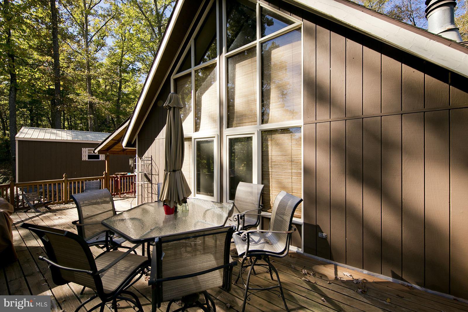 496 Audubon Road Hedgesville, WV 25427 - Photo 22 of 30 a outdoor dining space with furniture