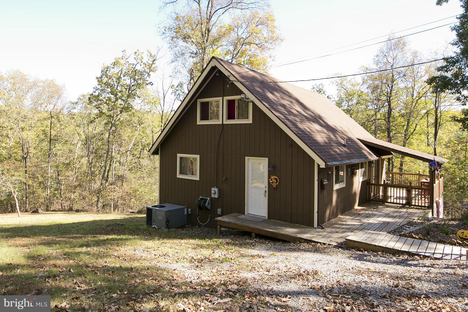 496 Audubon Road Hedgesville, WV 25427 - Photo 25 of 30 a backyard of a house with lots of green space