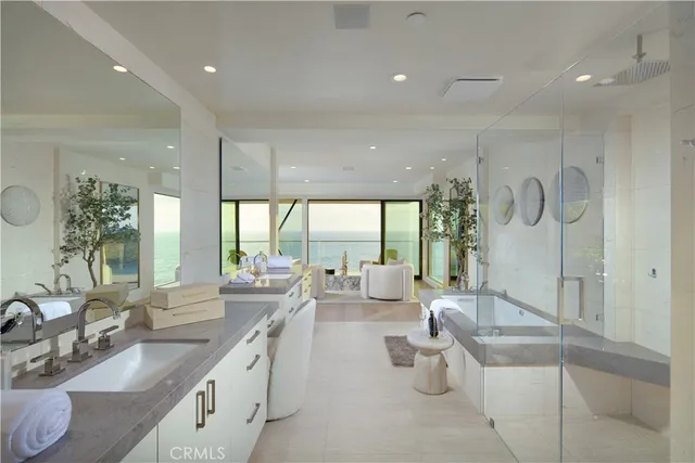 a bathroom with a shower sink double and mirror
