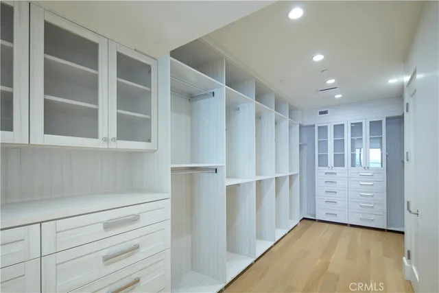 a living room with a fireplace and a floor to ceiling window