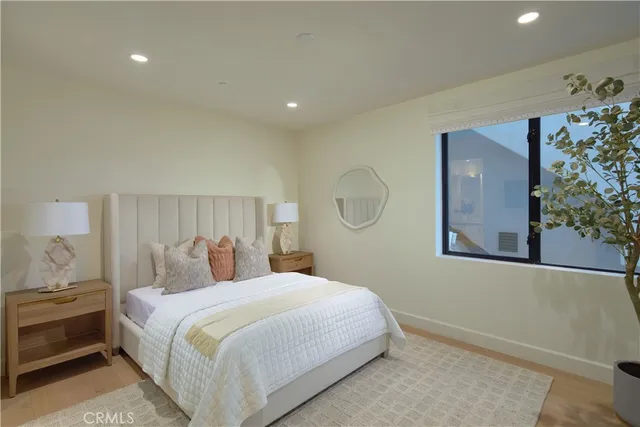 a living room with a floor to ceiling window and floor to ceiling window