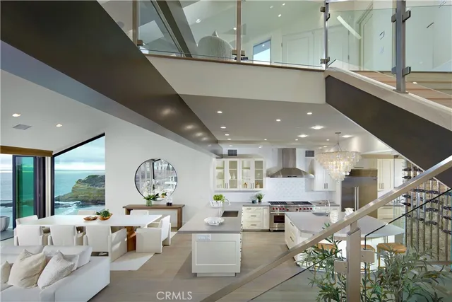 a kitchen with stainless steel appliances granite countertop a sink a stove and a refrigerator