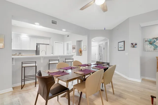a view of a dining room with furniture and wooden floor