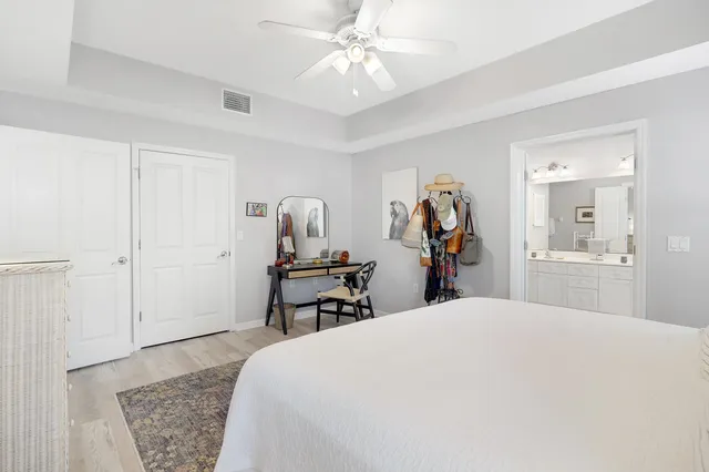 a bed room with a bed and a chandelier