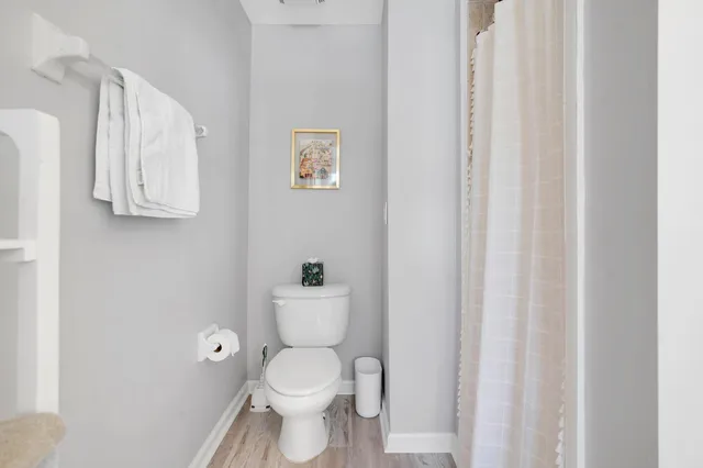 a a bathroom with a toilet and a sink