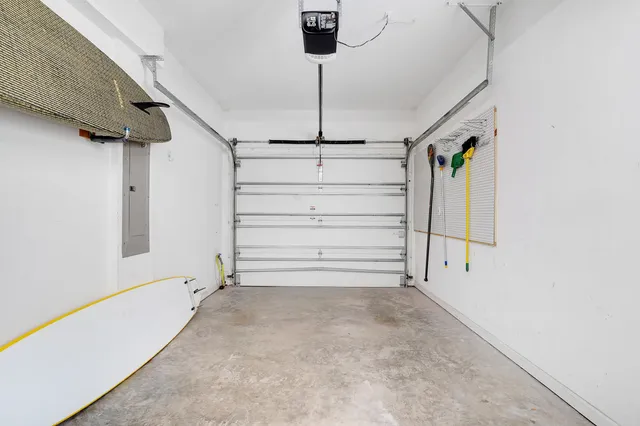 a view of a living room filled with furniture and wooden floor