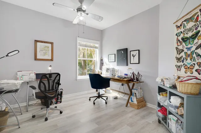 a view of a livingroom with furniture and a window