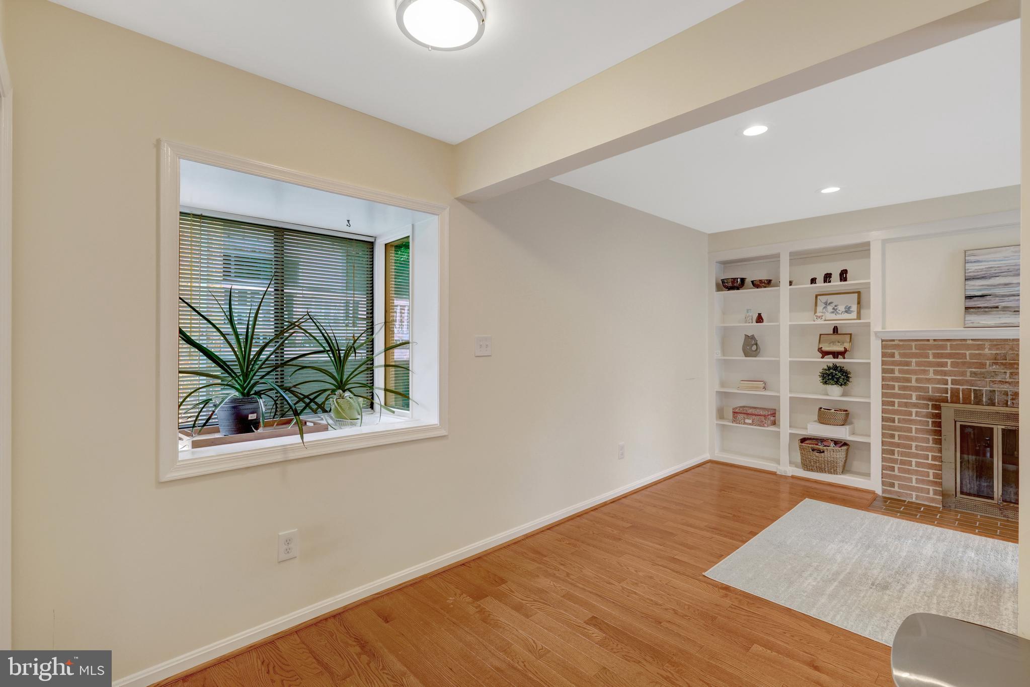 6868 Chelsea Road McLean, VA 22101 - Photo 12 of 41 a view of empty room with wooden floor and fan