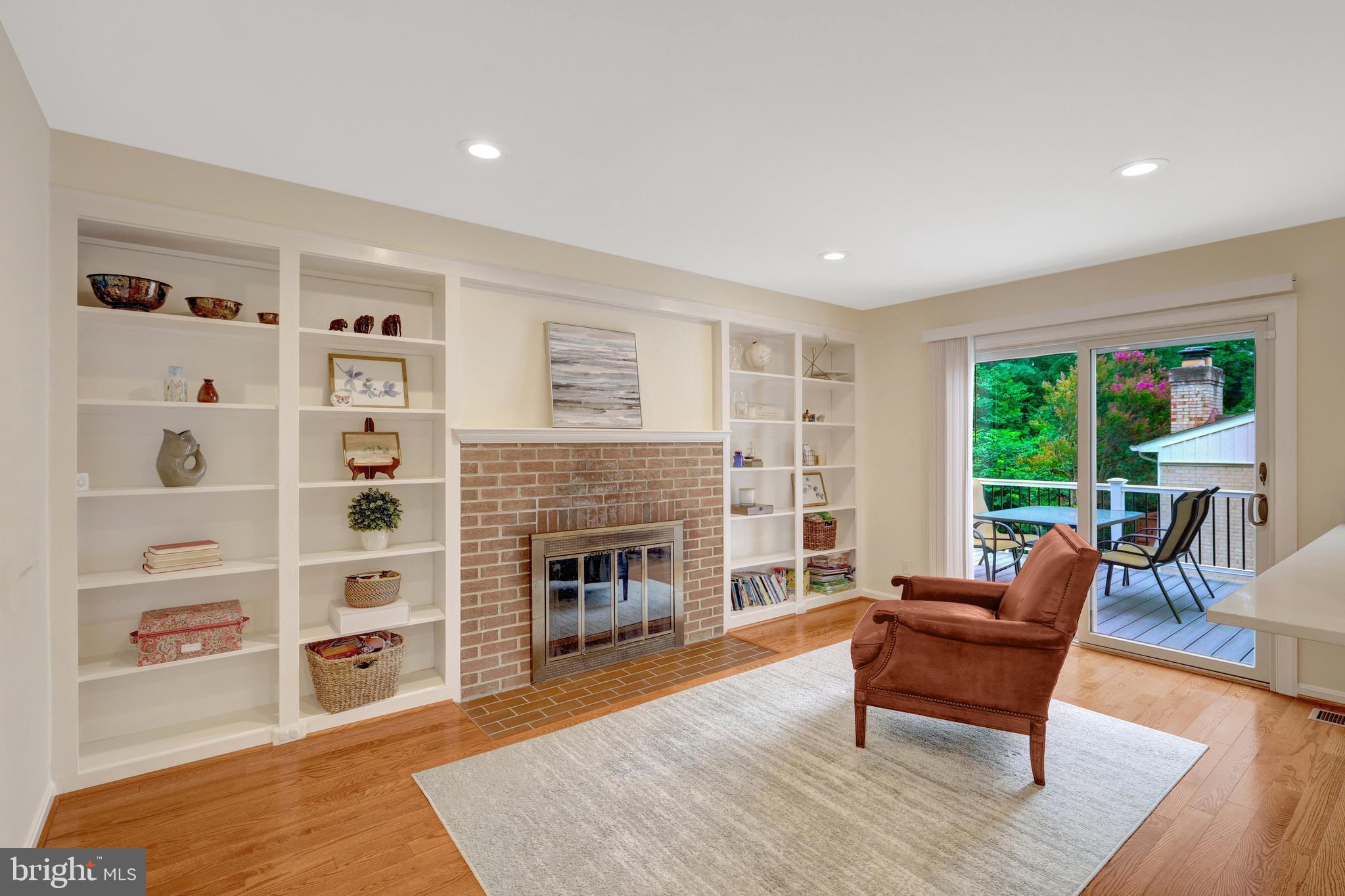 6868 Chelsea Road McLean, VA 22101 - Photo 13 of 41 a living room with furniture and a fireplace