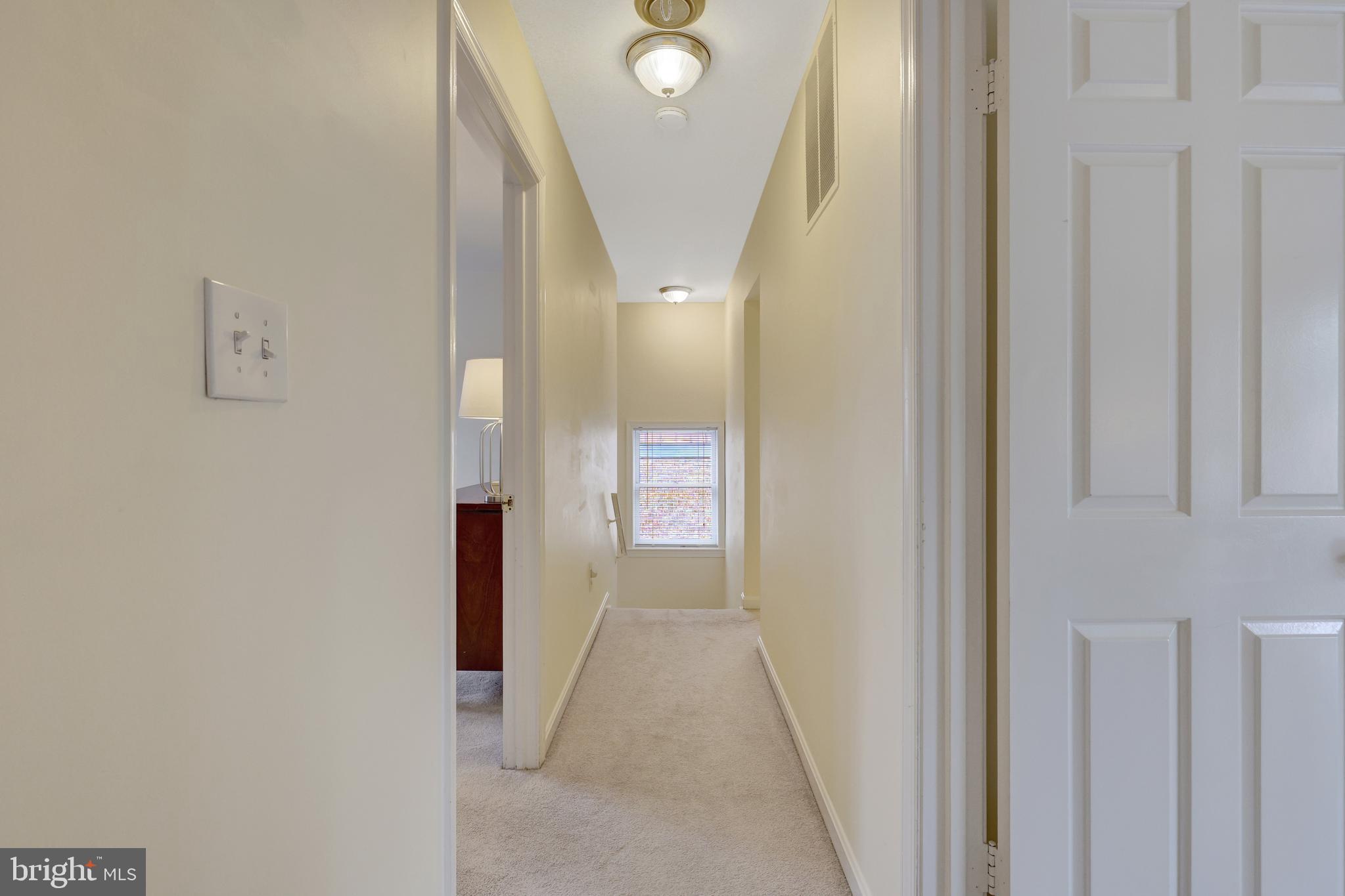 6868 Chelsea Road McLean, VA 22101 - Photo 18 of 41 a view of a hallway with wooden floor and entryway