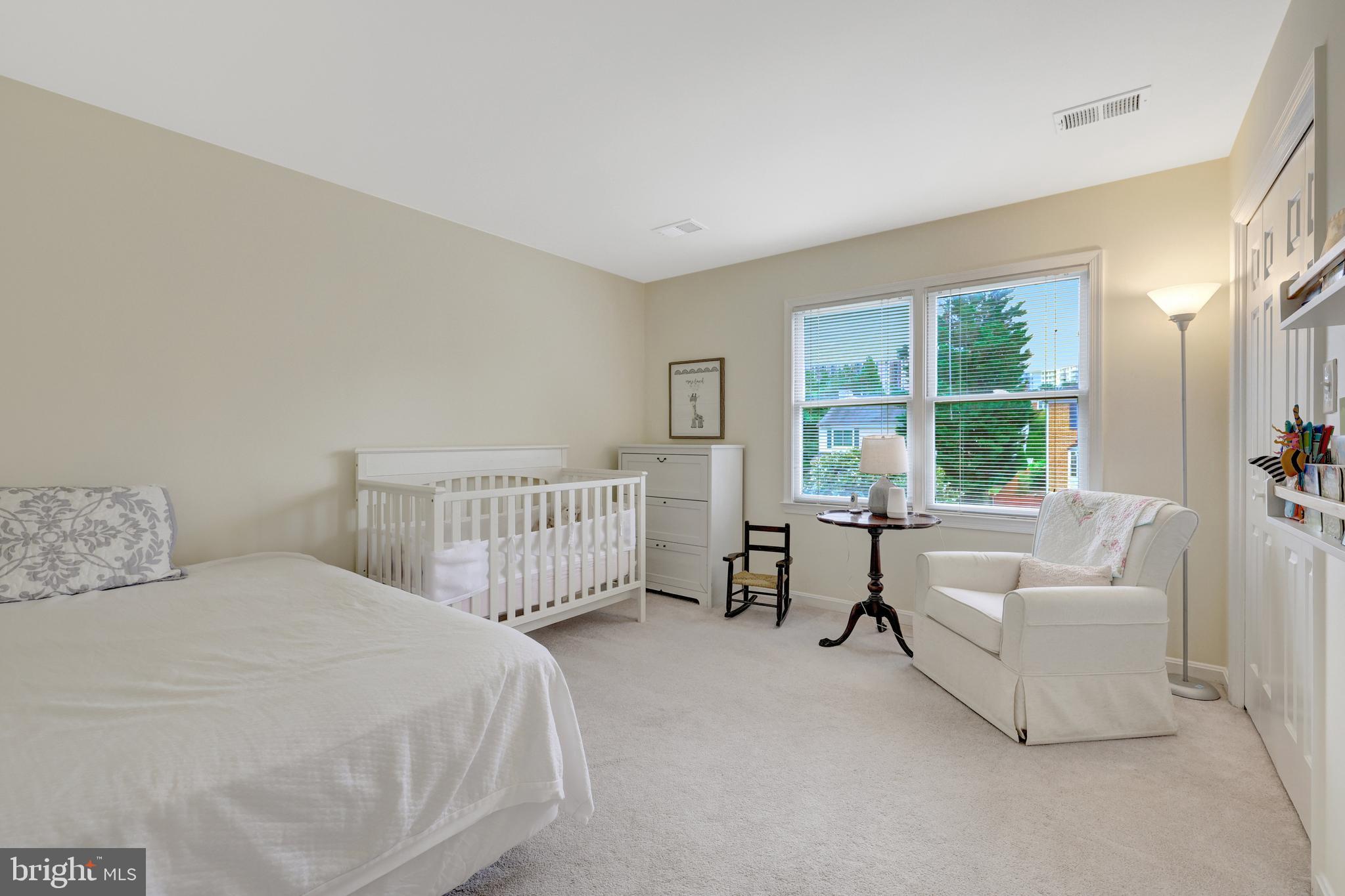 6868 Chelsea Road McLean, VA 22101 - Photo 20 of 41 a bedroom with a bed and a large window