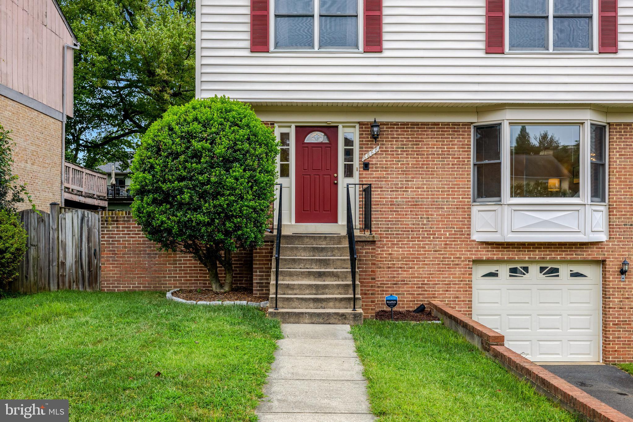 6868 Chelsea Road McLean, VA 22101 - Photo 2 of 41 a front view of a house with garden