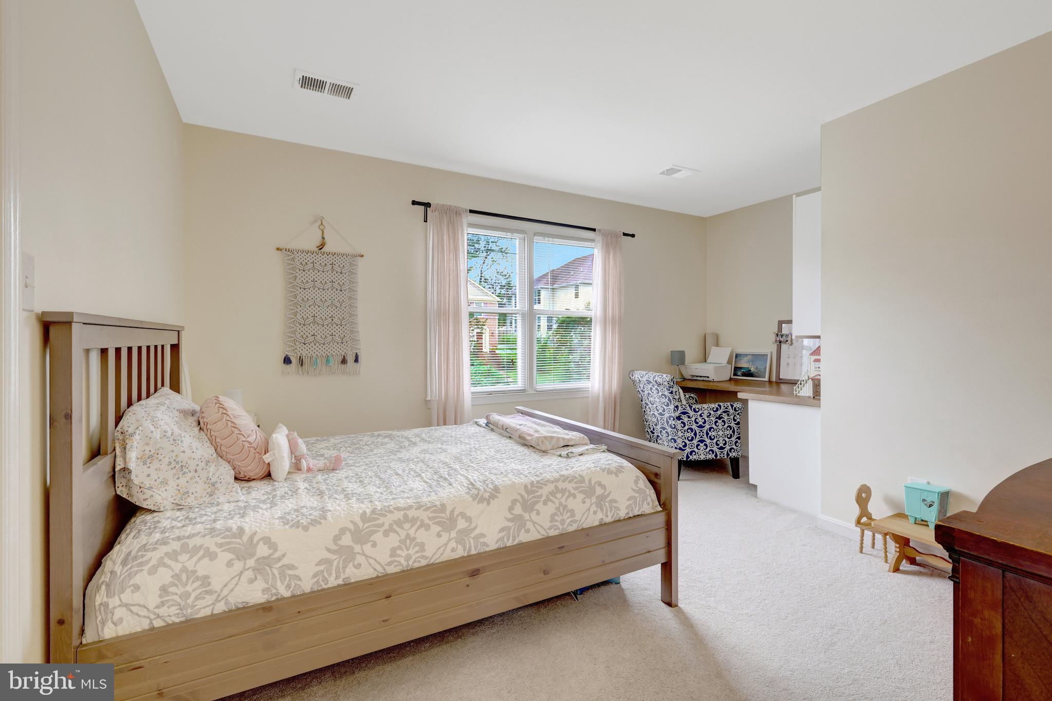 6868 Chelsea Road McLean, VA 22101 - Photo 22 of 41 a bedroom with a bed and a window
