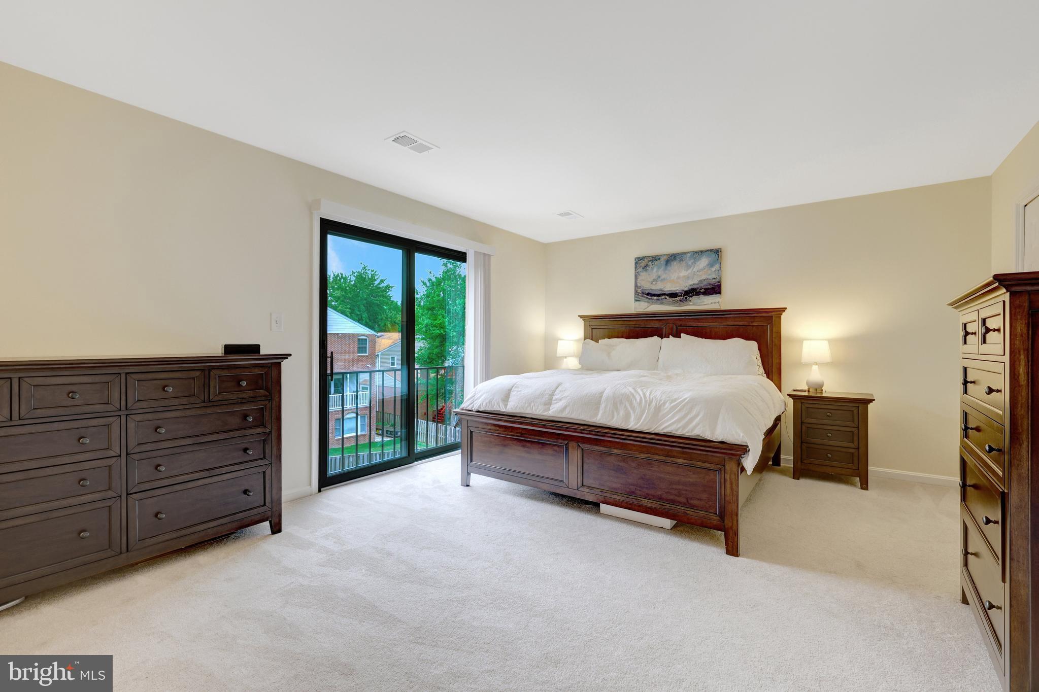 6868 Chelsea Road McLean, VA 22101 - Photo 24 of 41 a spacious bedroom with a bed and a cabinets
