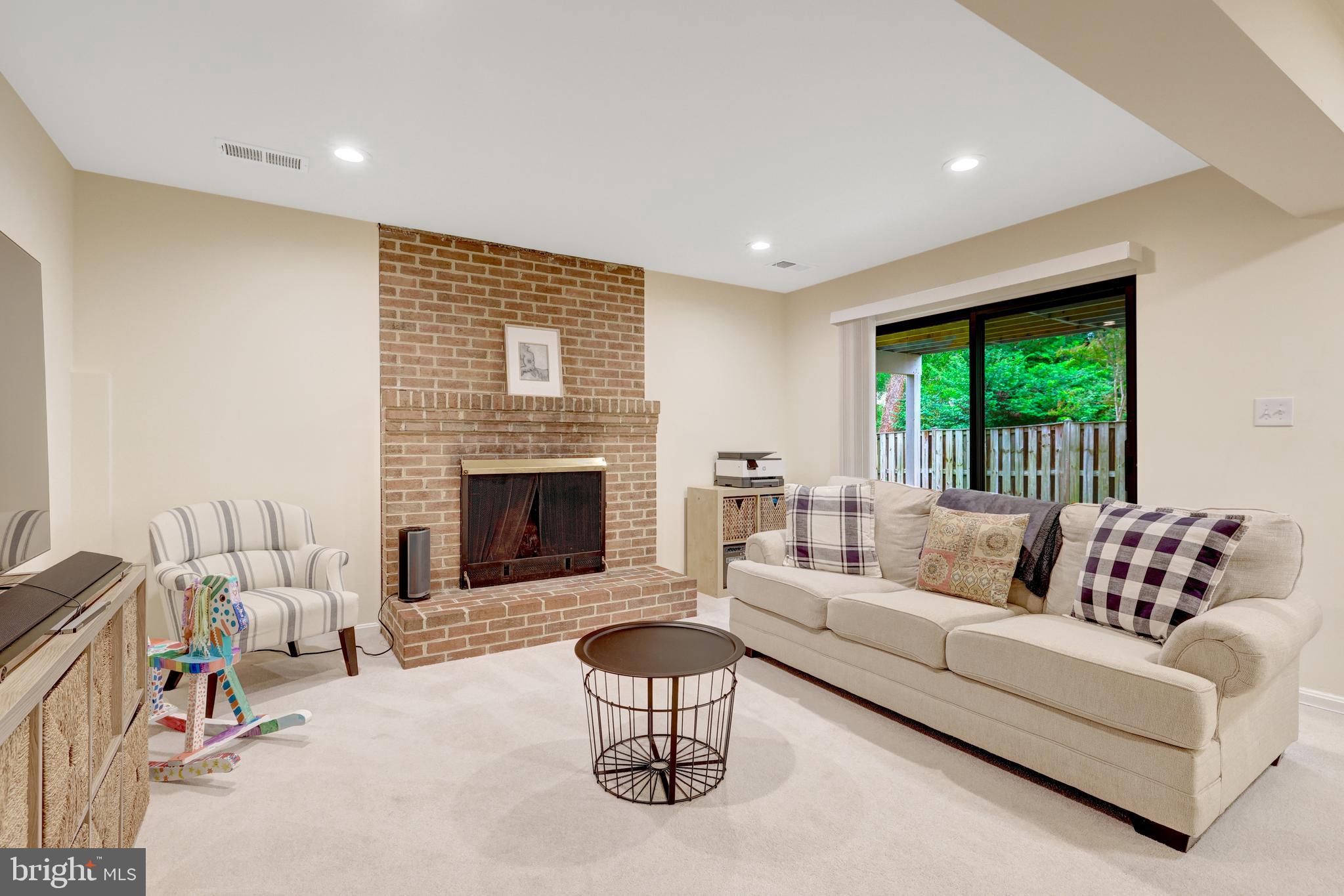 6868 Chelsea Road McLean, VA 22101 - Photo 31 of 41 a living room with furniture and a fireplace