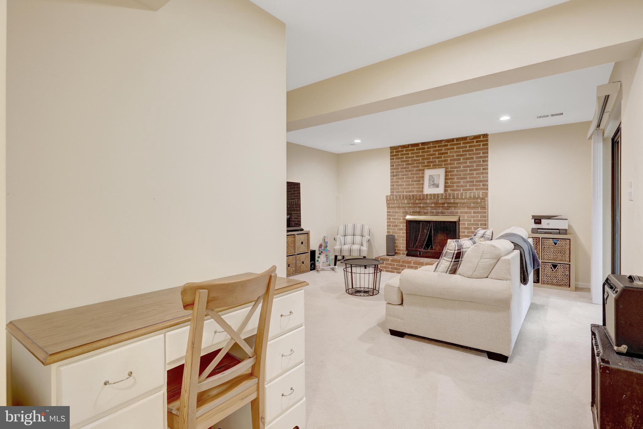 6868 Chelsea Road McLean, VA 22101 - Photo 32 of 41 a living room with furniture and a fireplace
