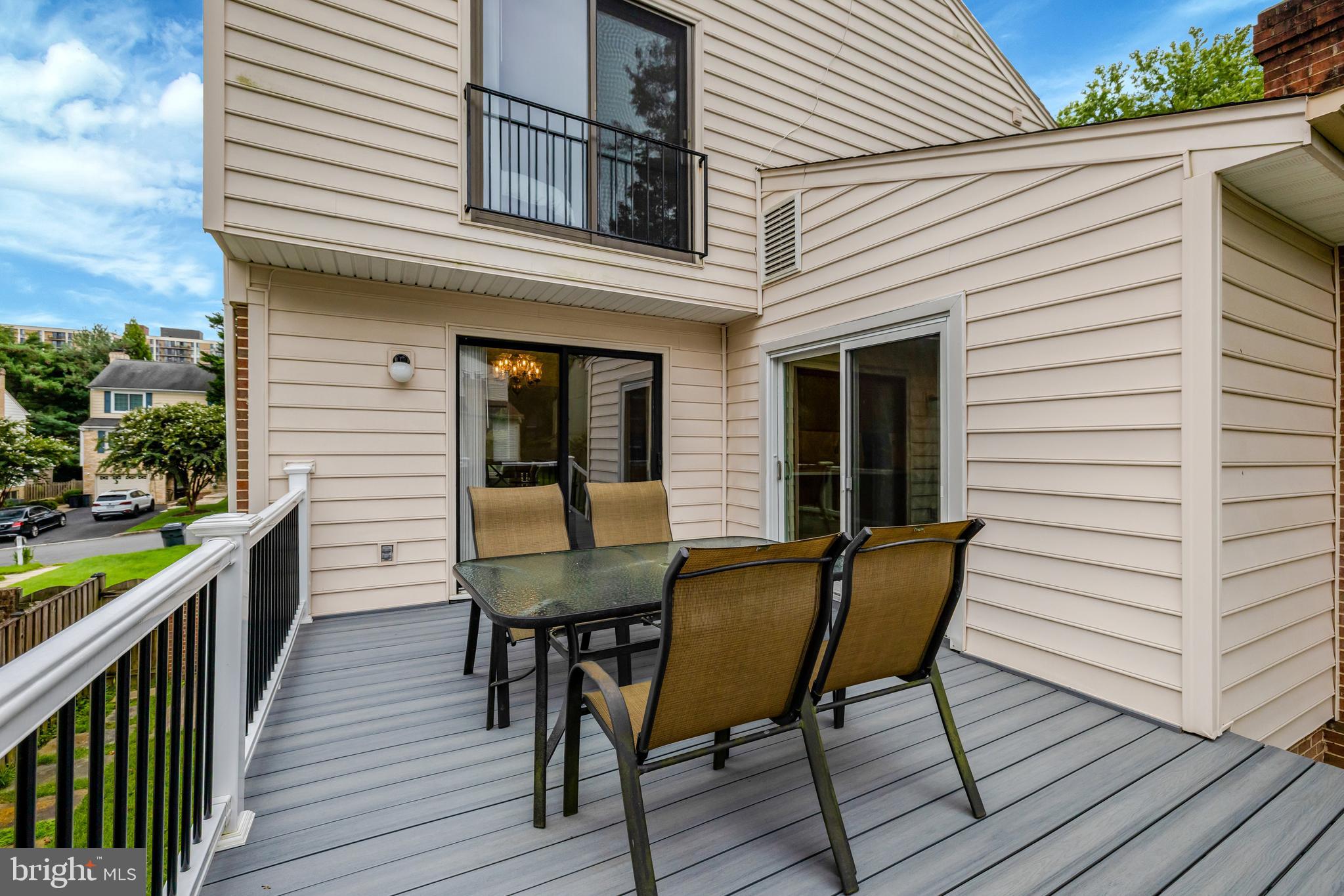 6868 Chelsea Road McLean, VA 22101 - Photo 36 of 41 a view of a deck with table and chairs with wooden floor and fence