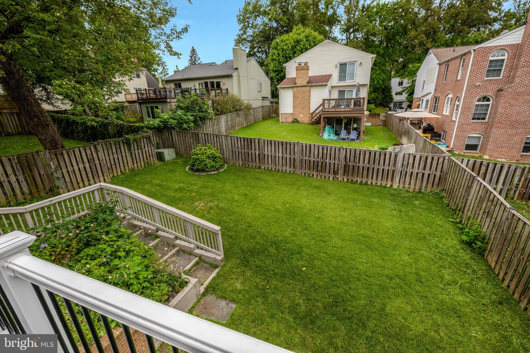 6868 Chelsea Road McLean, VA 22101 - Photo 37 of 41 a view of house with a small yard and deck