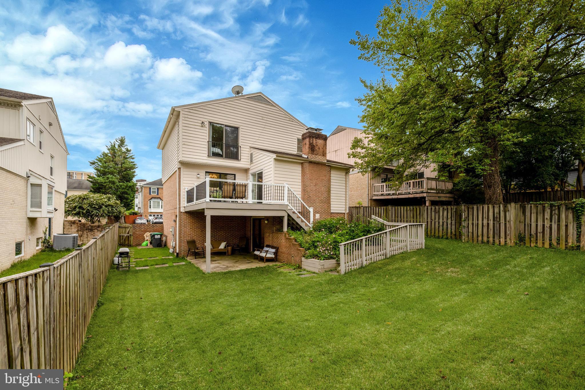 6868 Chelsea Road McLean, VA 22101 - Photo 40 of 41 a view of an house with backyard and a tree