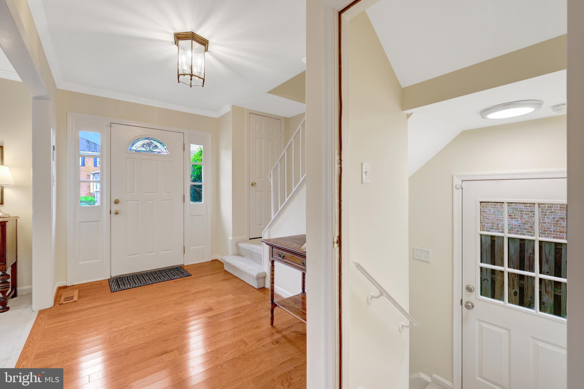 6868 Chelsea Road McLean, VA 22101 - Photo 4 of 41 a bedroom with a bed and a chandelier