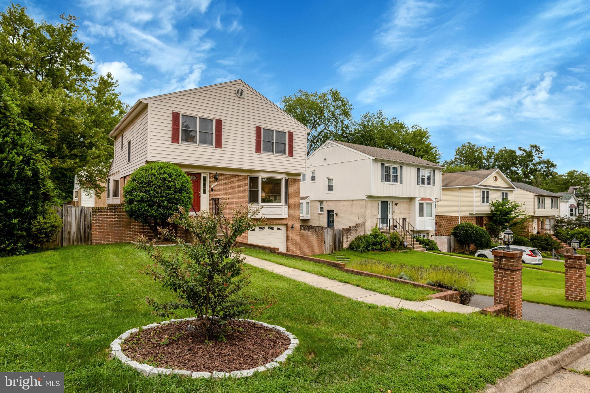6868 Chelsea Road McLean, VA 22101 - Photo 41 of 41 a front view of a house with a yard table and chairs