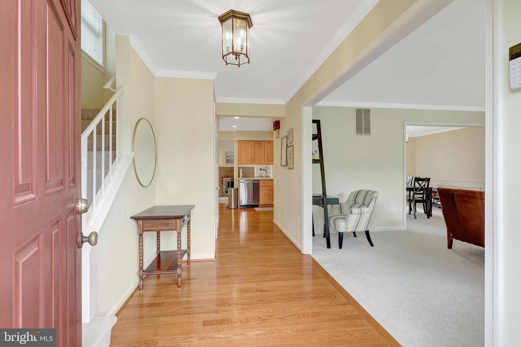 6868 Chelsea Road McLean, VA 22101 - Photo 6 of 41 a living room with furniture a table and wooden floor