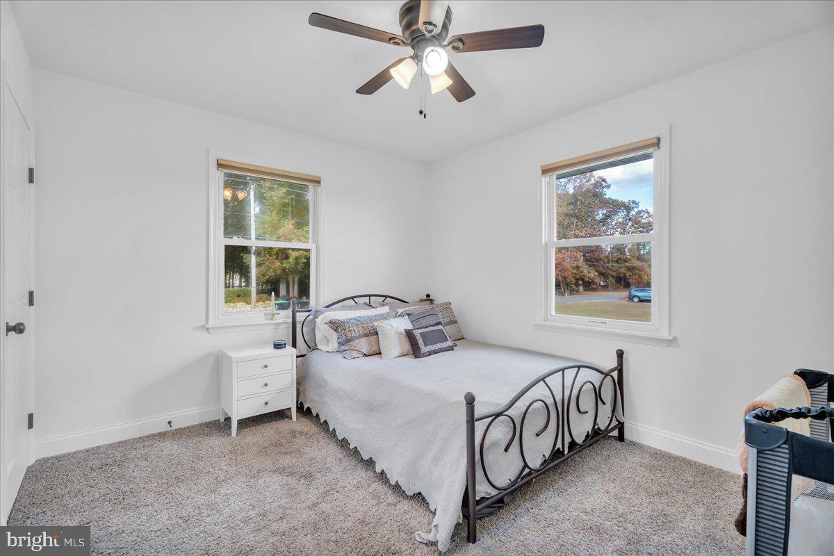 128 Cedarbrook Road Sicklerville, NJ 08081 - Photo 15 of 33 a bedroom with a bed and a window